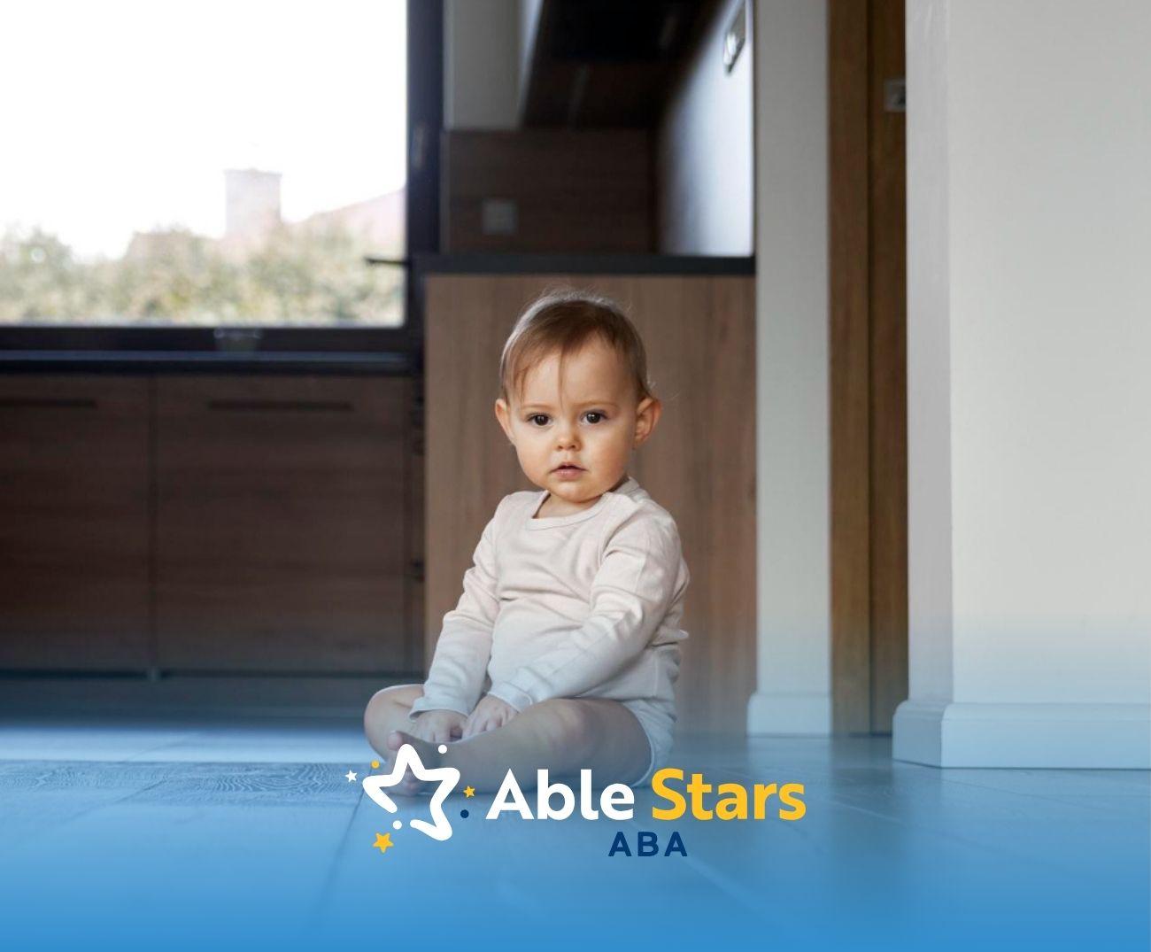 Autistic baby is sitting on the floor.