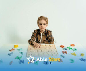 An autistic child sitting at a table with wooden alphabet puzzle and scattered letters in Maryland.