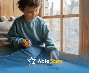 A kid with autism is playing with colorful blocks beside a window