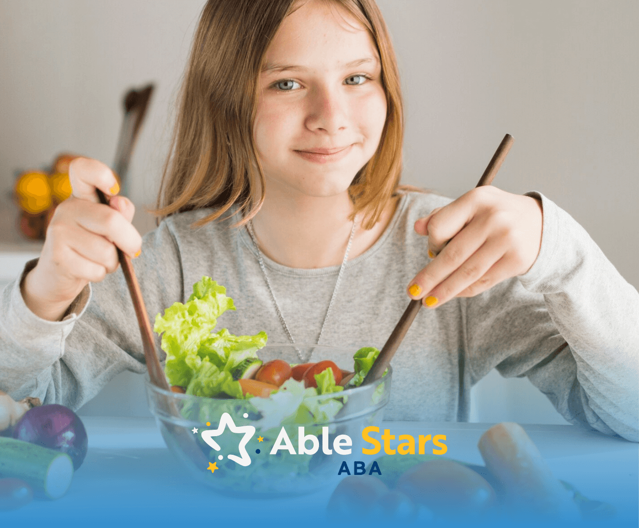 A girl with autism holding a wooden spoon and fork while eating a bowl of salad