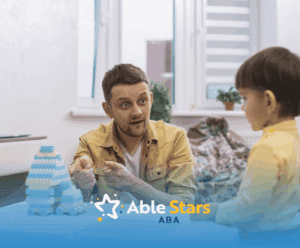 An ABA therapist and a boy with autism during ABA therapy