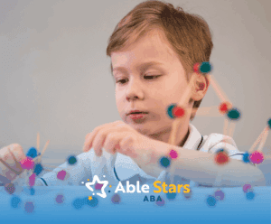 A child with autism playing with shapes on a table