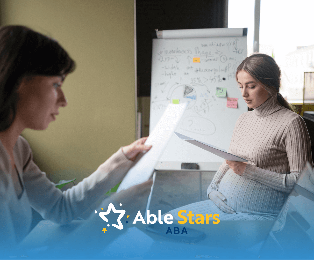 A pregnant lady looking at medical results with her OBGYN