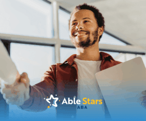 An adult with autism shaking his employers hand after getting hired for a job