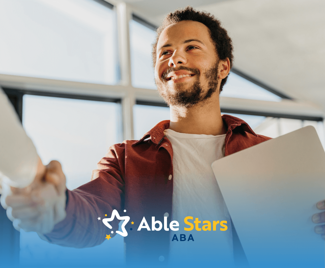 An adult with autism shaking his employers hand after getting hired for a job