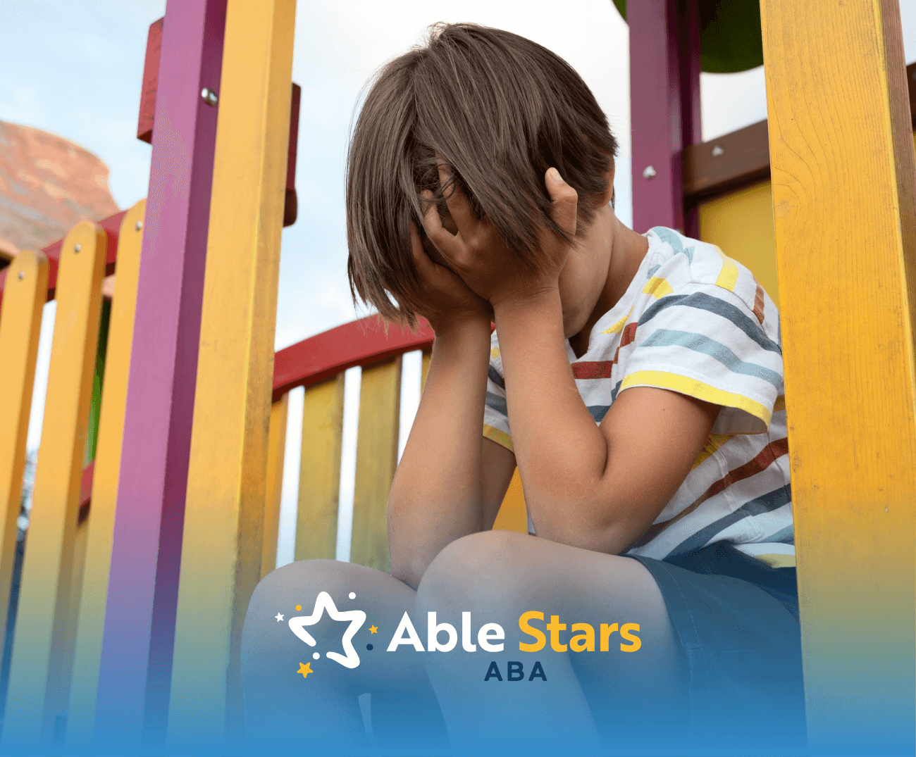 A child sitting alone in a park