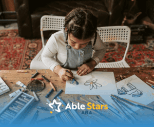 An autistic young girl focused on coloring a flower drawing at a table, crayons scattered during ABA therapy in MD.