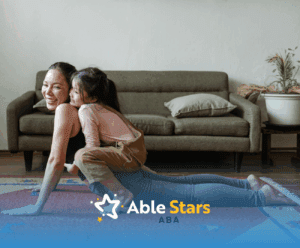 Autistic child hugging mother and expressing her love during an in-home ABA therapy session in Maryland.