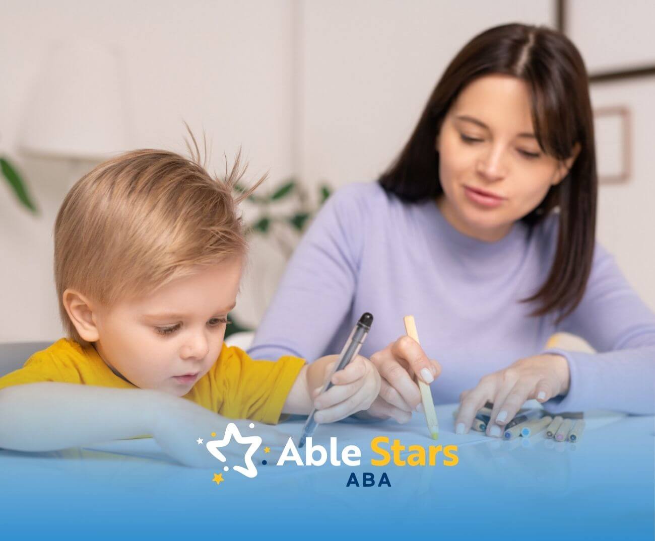 An ABA therapist working on a drawing activity with a child in ABA therapy.