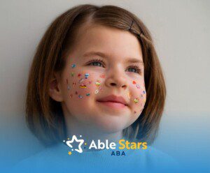 An autistic girl with colorful stickers on her face.