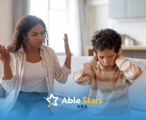A boy with autism covering his ears while a woman gestures in frustration.