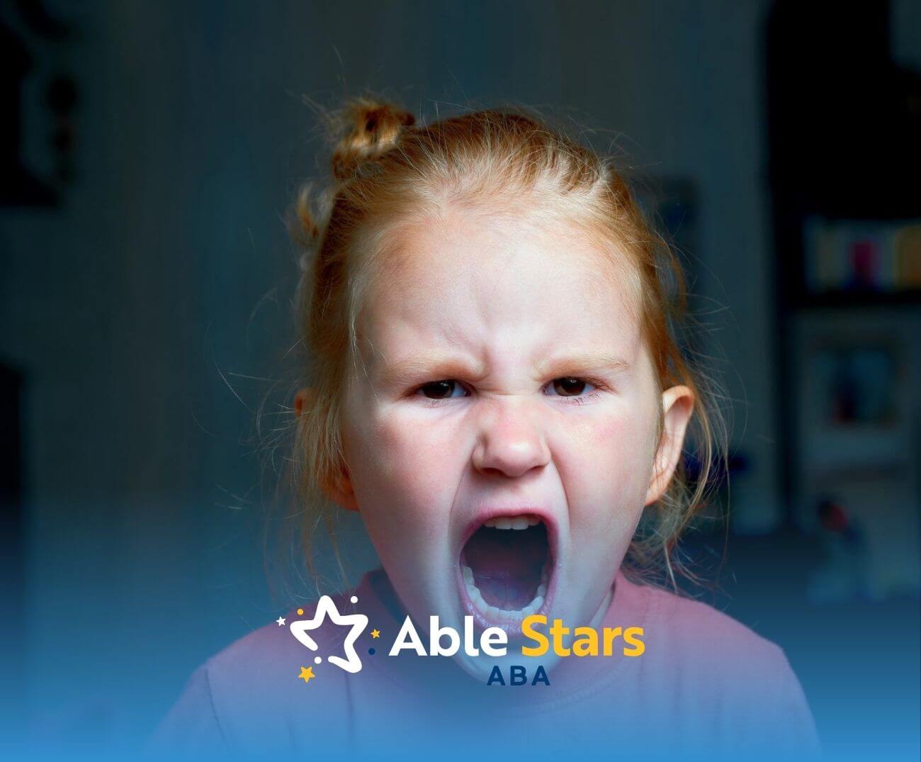 Young girl with autism having a tantrum and expressing frustration during ABA therapy.