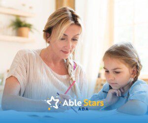 BCBA helping young daughter with homework at home during an ABA therapy activity.