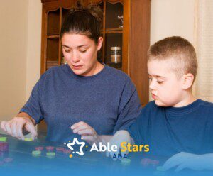 A woman and a child collaborate at a table, engaging with colorful tokens.